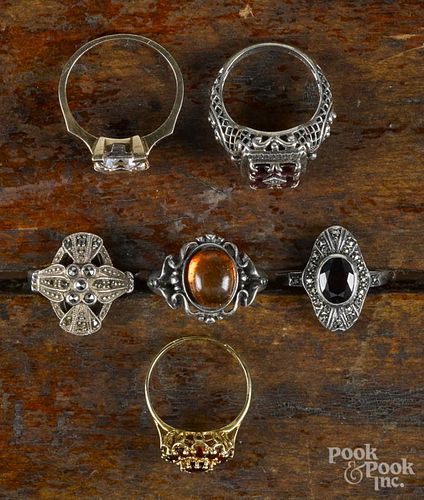 Six antique rings, to include an 18K yellow gold ring with a garnet cluster, a 14K yellow gold ring