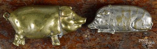 Two figural pig match vesta safes, ca. 1900, to include a brass example, 2 5/8'' l.