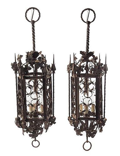 * A Pair of Gothic Style Wrought Iron Lanterns Height 35 inches.