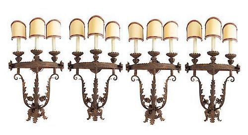 * A Set of Four Gilt and Patinated Metal Three-Light Sconces Height 19 inches.