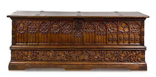 * A French Gothic Iron Mounted Walnut Chest Height 37 x width 96 x depth 26 inches.