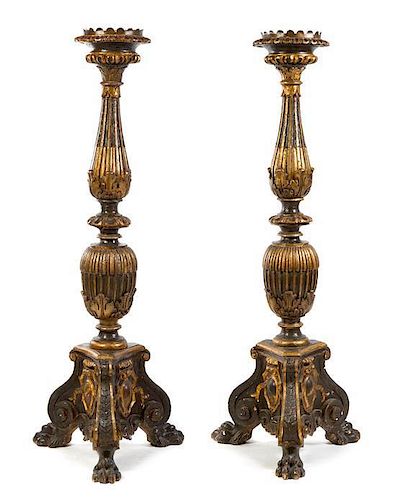 * A Pair of Neoclassical Style Parcel Gilt Prickets Height 71 inches.