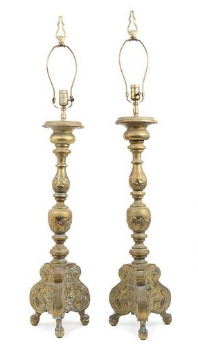 * A Pair of Baroque Style Brass Prickets Height 29 inches.