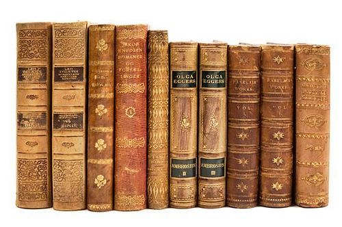 (BINDINGS) A group of 30 volumes bound in varying shades of tan leather, largely Danish language.