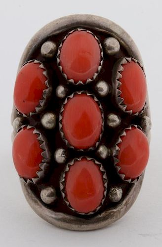 A NAVAJO STERLING AND CORAL RING