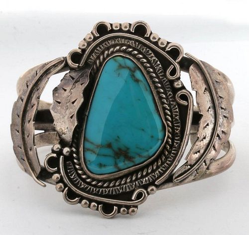 A LARGE NAVAJO STERLING AND TURQUOISE CUFF BRACELET