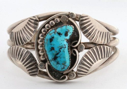 A NAVAJO STERLING SILVER AND TURQUOISE CUFF BRACELET