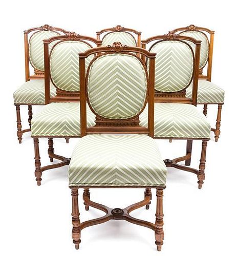 A Set of Six Louis XVI Style Walnut Dining Chairs Height 39 inches.