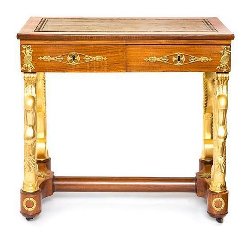 An Empire Style Parcel Gilt Fruitwood Writing Table Height 30 x width 32 x depth 19 inches.
