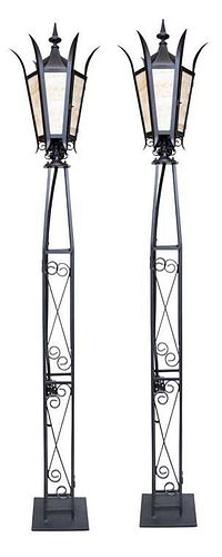 A Pair of Wrought Iron Torcheres Height 84 inches.