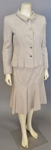 Chanel two piece suit including a silk twill tan jacket with fringe trim and matching skirt.