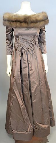 Arnold Scaasi, 1990s, Evening gown of brown silk satin, with gathered and draped panel at waist center front falling to form skirt front. Open bateau 