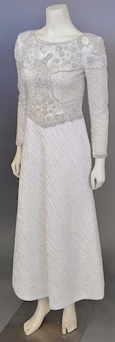 Mary McFadden, c. 2000, Evening gown with skirt of bias-cut crinkled white silk and bodice that is hand-embroidered with coils of silver, pearls, crys