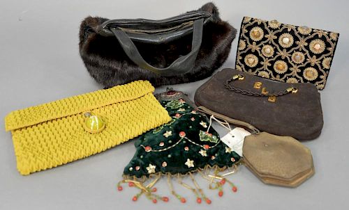 Six vintage purses to include two beaded purses, one leather with silver edge sold by Doyles, a mink purse, a silk purse and a leather purse.