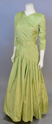 Christian Dior, Spring/Summer 1986, Evening dress of chartreuse silk. The skirt is gathered into the wrapped hip yoke; the bodice also has a wrapped e