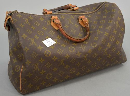 Louis Vuitton vintage brown monogram canvas bag with leather handles.