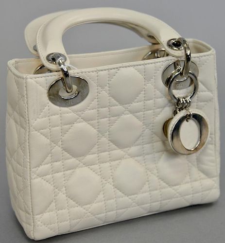 Christian Dior quilted white leather lambskin hand bag, this purse having leather handles and chrome...
