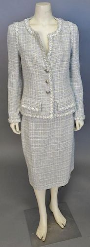 Chanel two piece suit, yellow and white tweed jacket and skirt.