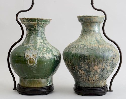 TWO SIMILAR HAN IRIDESCENT GREEN GLAZED POTTERY JARS, MOUNTED ON LAMP STANDS