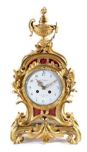A Louis XV Style Gilt Bronze Mantel Clock Height 19 1/4 inches.