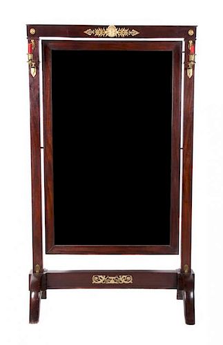 A French Empire Style Gilt Bronze Mounted Cheval Mirror Height 67 3/4 x width 38 1/4 inches.