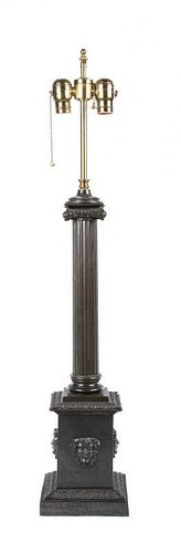 A Patinated Metal Table Lamp Height overall 23 inches.