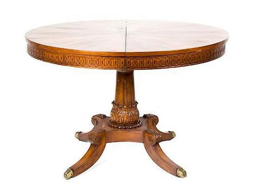 A Continental Inlaid Walnut Table Diameter 44 inches (closed); width of each leaf 23 7/8 inches.