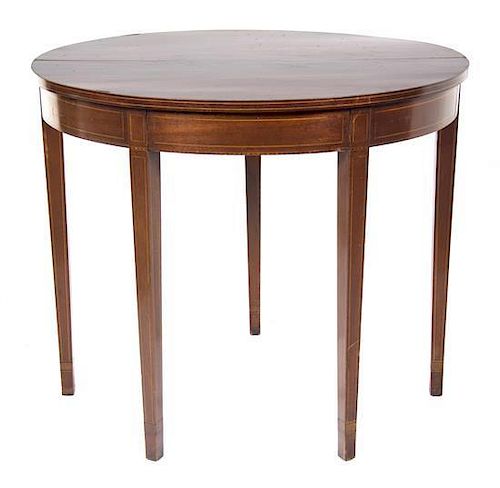 A George III Style Mahogany Flip-Top Table Height 30 x width 36 x depth 17 3/4 inches.