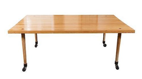 A Mid-Century Butcher-Block Dining Table Height 29 x width 77 1/2 x depth 48 inches.