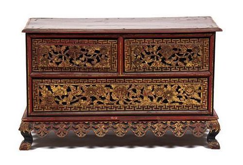 A Chinese Parcel Gilt Red Lacquer Carved Chest on Stand Height 22 x width 36 x depth 16 inches.