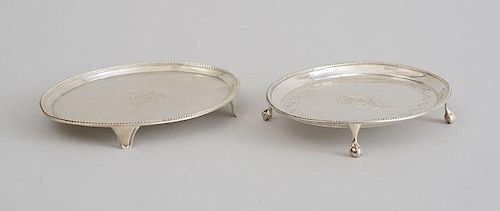 TWO GEORGE III SILVER TEAPOT STANDS