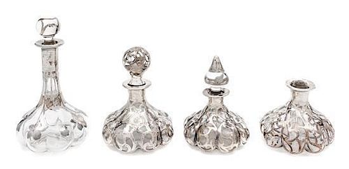* A Group of Four Silver Overlay Glass Perfume Bottles Height of tallest 6 1/2 inches.