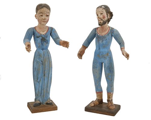 A pair of santos figures
