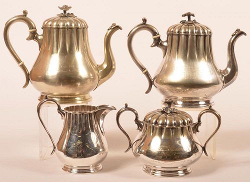Good four piece "Lodge" nickel on copper tea set with floral finials
