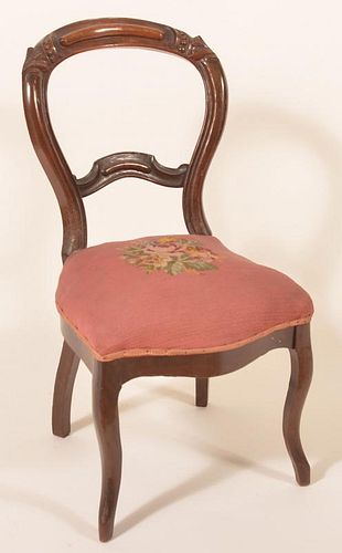 Victorian Walnut Carved and Molded side chair.