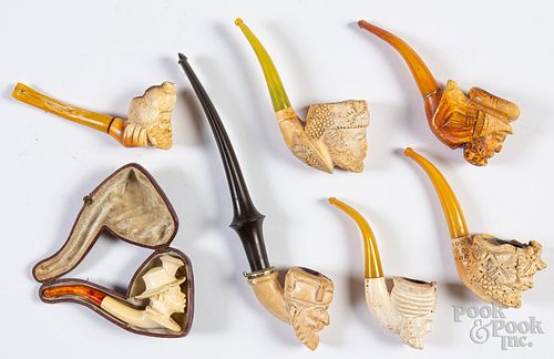 Seven carved Meerschaum pipes.