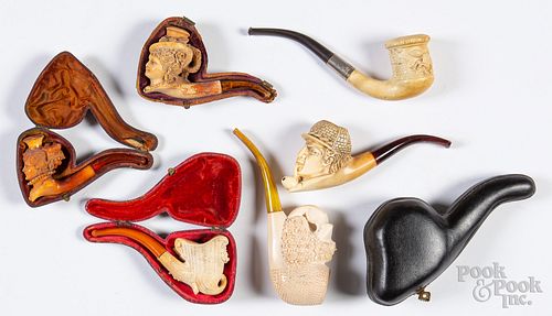 Six carved Meerschaum pipes.