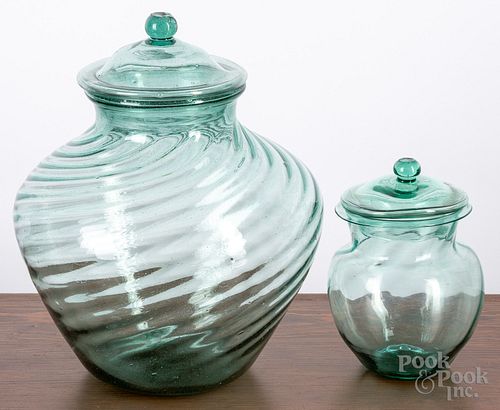 Two early blown aqua glass covered jars