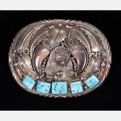 A Navajo Sterling Silver, Turquoise, Coral and Bear Claw Belt Buckle, 20th Century.