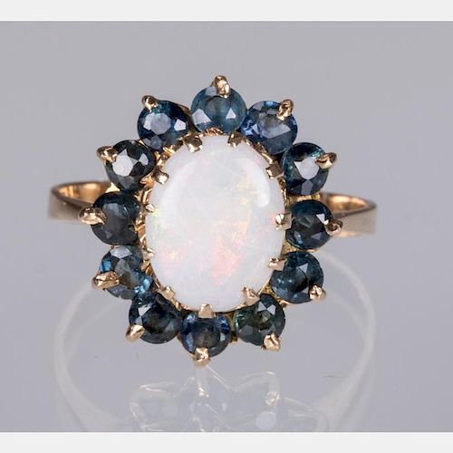 A 14kt. Yellow Gold, Opal and Sapphire Ring,