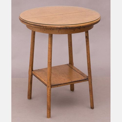 An American Rustic Tiger Maple Circular Two Tier Table, 19th Century.