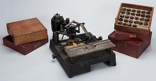 Dice Stamping Machine and Five Boxes of Metal Stamping Dies. New Hermes, N.Y., ca. 1940. This machine was used to stamp the name of the casino or club