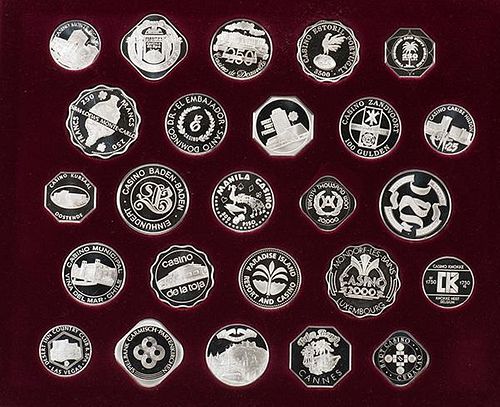 Gaming Coins of the WorldÍs Great Casinos. Franklin Mint, 1978. Set of 25 sterling silver gaming coins from as many casinos, housed in a maroon displ