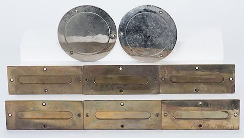 Eight Money Drop Slots. American, ca. 1930. Two being nickel-plated, six in brass. These drop slots were attached to the table over a cash box, into w