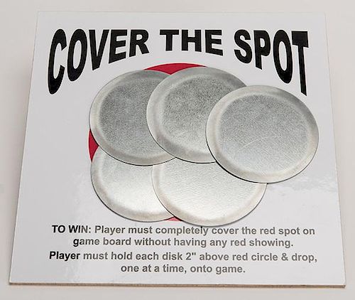 Cover the Spot Carnival Game. Circa 1970. Drop the five aluminum discs from a height of at least two inches and completely cover the red spot to win a