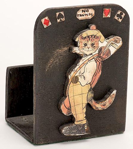 Trump Indicator and Deck Holder. Circa 1930. Wood cat trump indicator and double deck holder. Cat dressed in golf togs, toting a golf bag. Overall ver