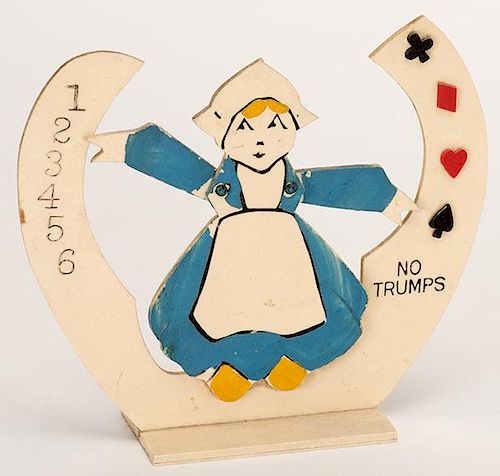 Trump Indicator and Table Marker. Little Dutch Girl. Circa 1930. Celluloid trump indicator and table marker with slight paint loss to girlÍs dress, o