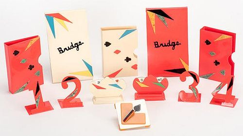 Two Sets of Bridge Accessories. Including a multi-colored celluloid trump indicator, score pad holder and deck holder