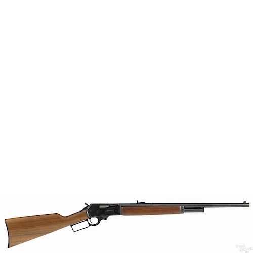 Marlin model 1895 lever action rifle, chambered in 45-70, with a blued finish and a walnut stock