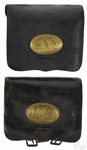 Two Civil War musket leather cartridge boxes, one inscribed US on an oval plate
